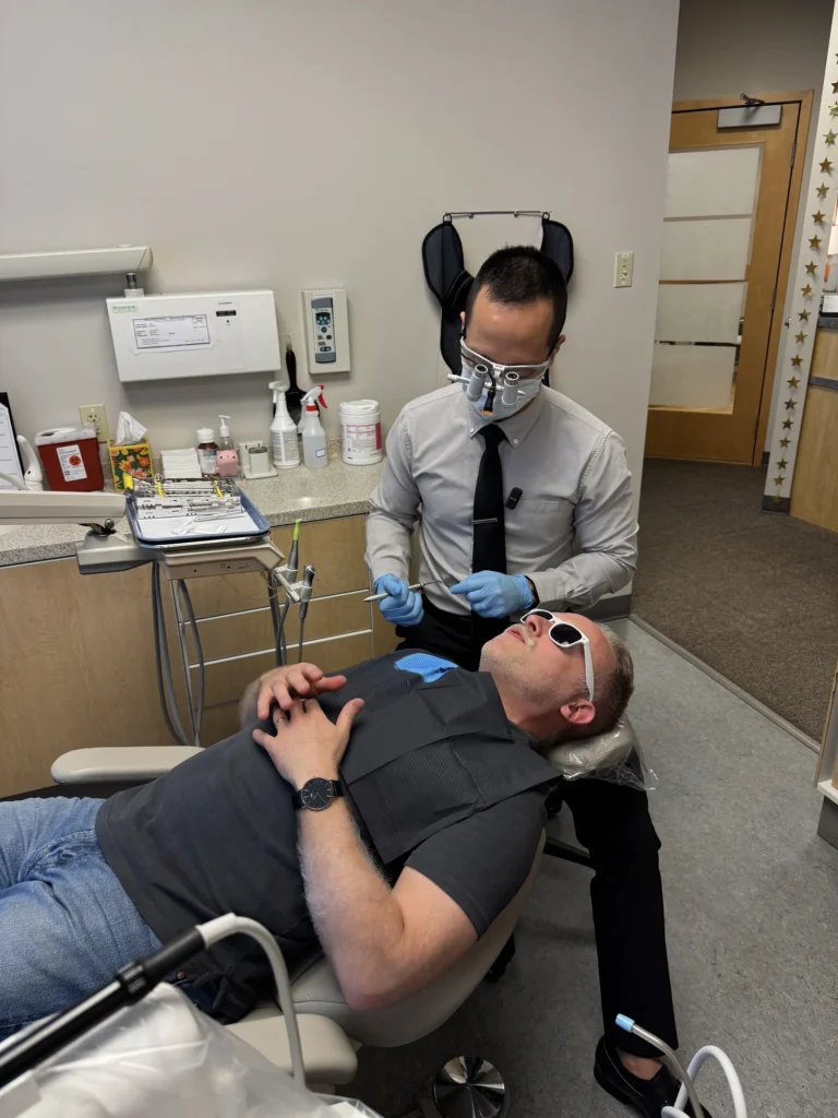 Dr. Cho treating a patient in the dental chair
