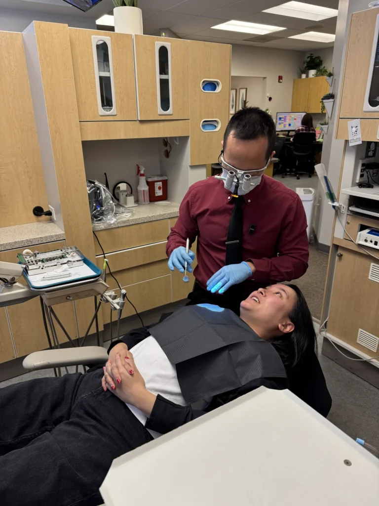Dr. Cho treating a patient in the chair
