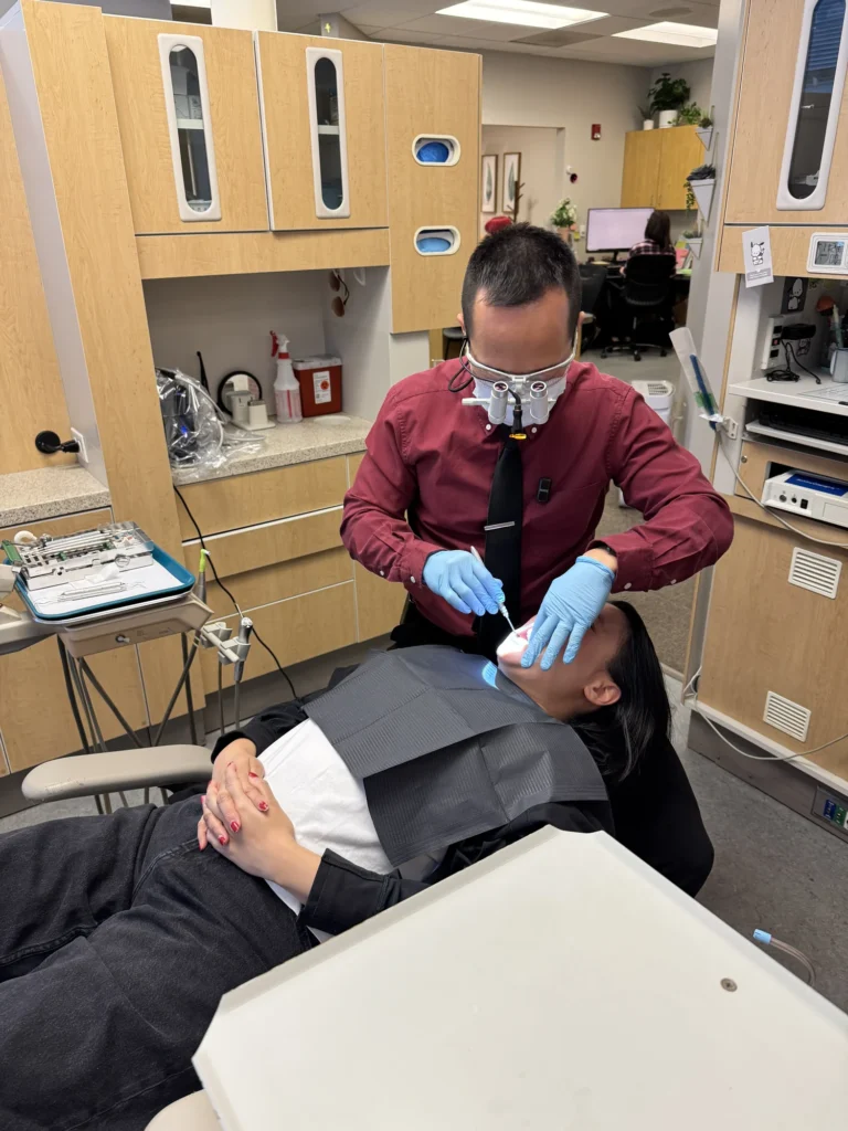 Dr. Cho treating a patient in the chair