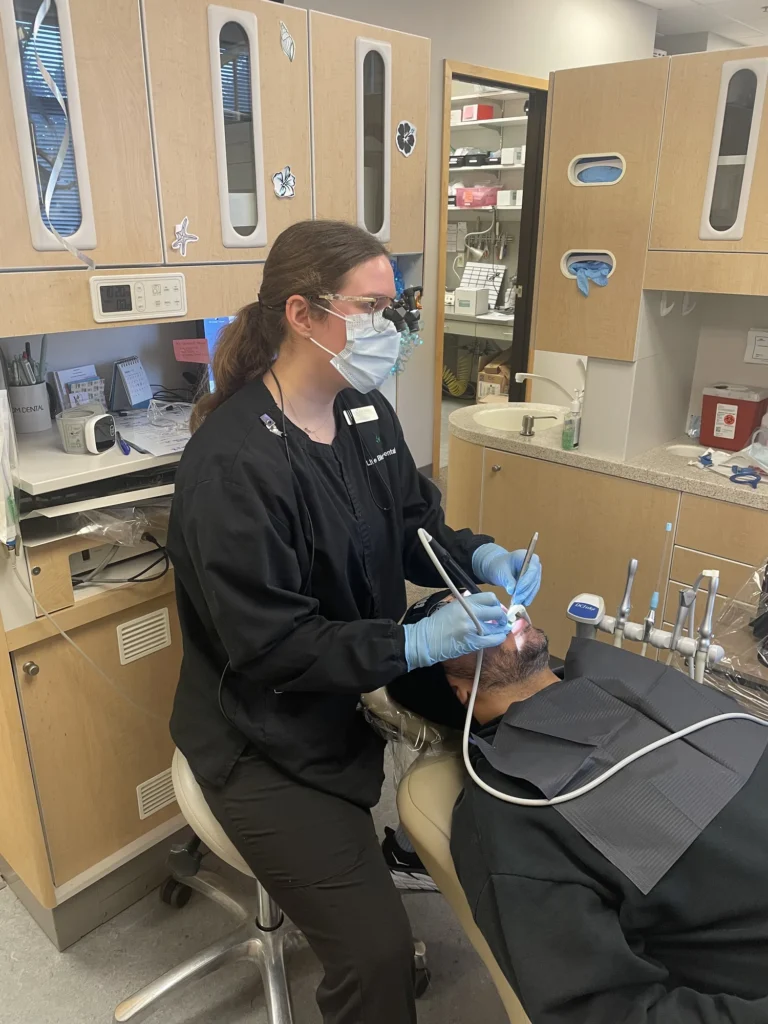 A Life Bloom Dental hygienist with a patient during a cleaning