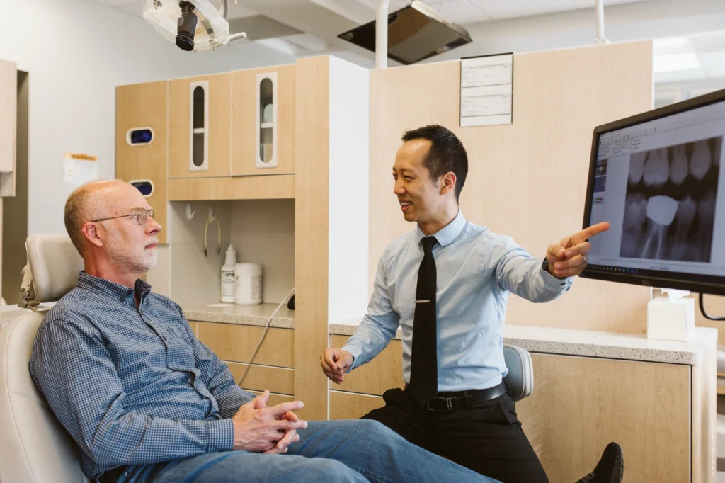 Dr. Cho walking a patient through his x-rays on the chairside screen