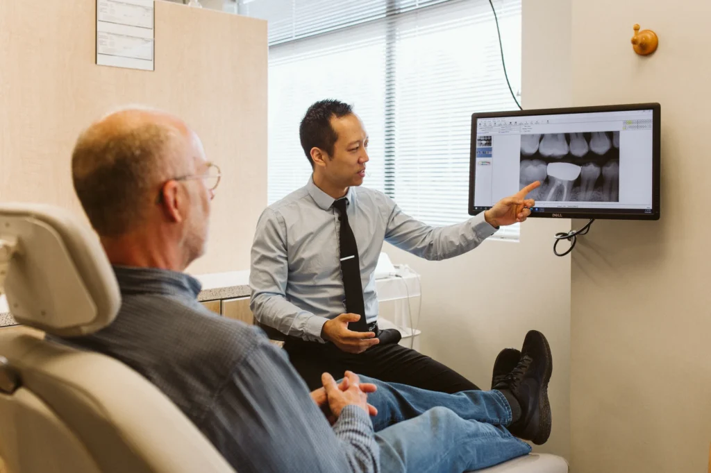 Dr. Cho reviewing an X-ray with a patient