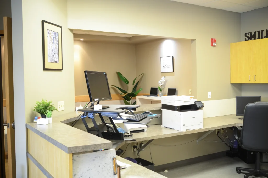 The Life Bloom Dental front desk, where the team checks your benefits